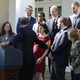 Barack Obama reaches out to help a woman who began to faint during a speech about health care in October 2013.